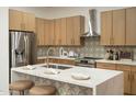 Beautiful kitchen featuring modern cabinetry, stainless steel appliances and quartz countertops at 6137 E Roland St, Mesa, AZ 85215