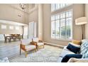 Living area showcasing two armchairs and a couch near large windows at 6618 W Red Fox Rd, Phoenix, AZ 85083