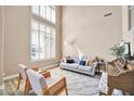 Light-filled living room with comfy seating and a piano at 6618 W Red Fox Rd, Phoenix, AZ 85083