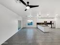 Open floor plan living area featuring tile flooring and a ceiling fan at 6638 S 6Th Ave, Phoenix, AZ 85041