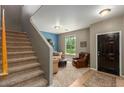 Living area with stairs to upper level at 875 S Brewer Dr, Gilbert, AZ 85296