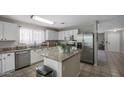 Spacious kitchen featuring granite countertops and stainless steel appliances at 9176 N 82Nd Ln, Peoria, AZ 85345