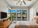 Spacious bedroom with large windows and a ceiling fan at 925 E Piedmont Rd, Phoenix, AZ 85042