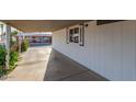 Covered carport area adjacent to the manufactured home at 9302 E Broadway Rd # 103, Mesa, AZ 85208