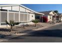 Street view of manufactured homes in a community setting at 9302 E Broadway Rd # 103, Mesa, AZ 85208