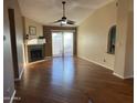 Spacious living room with hardwood floors and fireplace at 945 N Pasadena St # 113, Mesa, AZ 85201