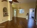 Bright living room with hardwood floors and access to kitchen at 945 N Pasadena St # 113, Mesa, AZ 85201