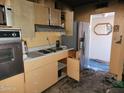 Kitchen with outdated appliances and cabinets at 14820 N 31St Dr, Phoenix, AZ 85053