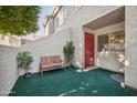 Private patio with artificial turf and bench at 2121 S Pennington Rd # 12, Mesa, AZ 85202