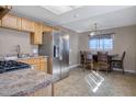 Kitchen boasts stainless steel appliances and wood cabinets at 2733 W Alice W Ave, Phoenix, AZ 85051