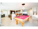 Open concept kitchen and game room with a pool table and bar seating at 2806 N 82Nd St, Scottsdale, AZ 85257