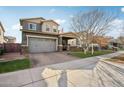 Two-story home with gray exterior, double garage, and landscaped yard at 3045 E Bloomfield Pkwy, Gilbert, AZ 85296