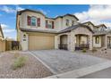 Two-story home with stone accents and a 3-car garage at 5651 E Sierra Morena St, Mesa, AZ 85215