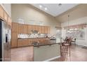 Spacious kitchen features a large island, granite countertops, stainless steel appliances, and bright breakfast nook at 6216 W Morrow Dr, Glendale, AZ 85308