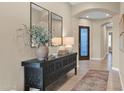 Bright entryway with a console table and mirrors at 6664 S Jacqueline Way, Gilbert, AZ 85298