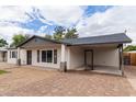 Side view of charming single-story home with covered carport at 1018 S Butte Ave, Tempe, AZ 85281