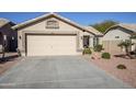 Front view of a single-story house with a two-car garage at 10356 W Ross Ave, Peoria, AZ 85382