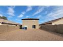 Tan two story house with gravel backyard at 11215 W Heatherbrae Dr, Phoenix, AZ 85037