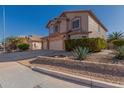 Two-story house with three-car garage and landscaped yard at 1313 W Glenmere Dr, Chandler, AZ 85224