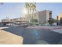 Condo building with palm trees and parking spaces at 1645 W Baseline Rd # 2075, Mesa, AZ 85202