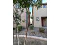 Narrow gravel walkway between two houses at 1727 W Pollack St, Phoenix, AZ 85041