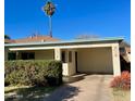 Brightly painted home with a covered entryway and a well-maintained landscape at 178 W Harrison St, Chandler, AZ 85225