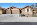 Brick home with 3-car garage and landscaped front yard at 18404 W Long Lake Rd, Goodyear, AZ 85338