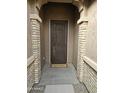 Charming front door entryway with decorative security door and welcome mat at 18404 W Long Lake Rd, Goodyear, AZ 85338