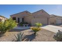 Charming one-story home with a welcoming front porch and neatly landscaped yard at 18509 N Toya St, Maricopa, AZ 85138