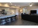 Open concept kitchen and living area with breakfast bar and seating at 20660 N 40Th St # 2159, Phoenix, AZ 85050