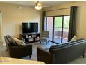 Spacious living room featuring hardwood floors and access to a balcony at 20660 N 40Th St # 2159, Phoenix, AZ 85050