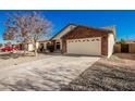 House exterior featuring a two-car garage and a large driveway at 2193 S Tucana Ln, Gilbert, AZ 85295