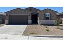 A lovely single-Gathering home featuring a two-car garage and xeriscaping in a tranquil setting at 22541 W Pontiac Dr, Surprise, AZ 85387
