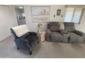 Cozy living room with comfy recliner and side table at 2271 S Seminole Dr, Apache Junction, AZ 85119