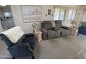 Relaxing living room with recliner and view into bathroom at 2271 S Seminole Dr, Apache Junction, AZ 85119