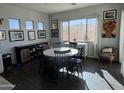 Bright dining room with a round table and six chairs at 22917 E Camina Buena Vis, Queen Creek, AZ 85142