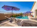 Inviting backyard oasis with a refreshing pool and patio at 22917 E Camina Buena Vis, Queen Creek, AZ 85142