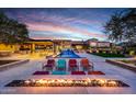 Stunning pool and fire pit area with modern seating at 24258 N 91St St, Scottsdale, AZ 85255