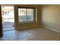 Living room with tile flooring and view of front yard at 2429 E Calypso Ave, Mesa, AZ 85204