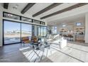 Bright living room with wood floors, beamed ceilings, large sliding glass doors and modern furnishings at 24642 N 123Rd St # 114, Scottsdale, AZ 85255