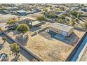 Aerial view of house and large detached shop on a spacious lot at 2602 S 226Th Dr, Buckeye, AZ 85326