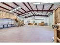 Large workshop with loft, storage, and roll-up door at 2602 S 226Th Dr, Buckeye, AZ 85326