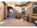 Private courtyard with wrought iron gate and terracotta pots at 26783 W Piute Ave, Buckeye, AZ 85396