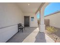 Covered front porch with bench, providing a relaxing entryway at 31063 W Cheery Lynn Rd, Buckeye, AZ 85396