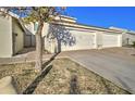 Attached garage with driveway and landscaping at 3134 E Mckellips Rd # 168, Mesa, AZ 85213