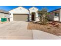 New construction home with two-car garage and desert landscaping at 40130 W Sunland Dr, Maricopa, AZ 85138