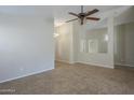 Spacious living room featuring tile floors and a ceiling fan at 44865 W Horse Mesa Rd, Maricopa, AZ 85139