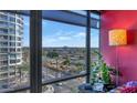 Bright living room with floor-to-ceiling windows and city views at 4808 N 24Th St # 803, Phoenix, AZ 85016