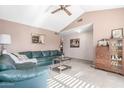 Spacious living room with hardwood floors, a wood burning fireplace, and a large window at 4944 E Windrose Dr, Scottsdale, AZ 85254