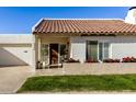 Charming single-story home with a terracotta tile roof and well-manicured lawn at 6318 N 14Th St, Phoenix, AZ 85014